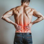 AI generated image of a man holding his back as if he has a sore back